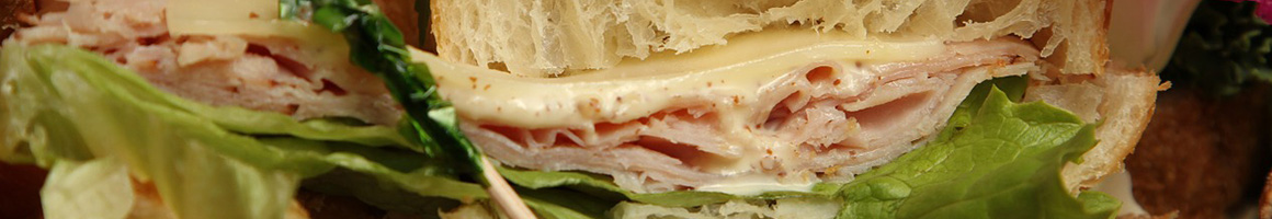 Eating Mediterranean Pizza Sandwich at Le Pam Pam Pizza & Subs.